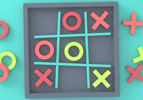 The image shows a tic-tac-toe game with red Xs and green Os, played within a framed grid, with extra pieces scattered around the board.