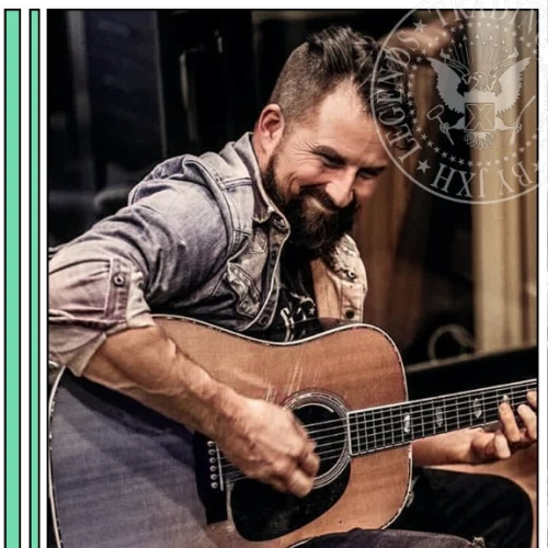 Man playing an acoustic guitar, smiling warmly, wearing a denim shirt; badge overlay reads &ldquo;Leigh Gilbert&rdquo; and &ldquo;Malpractice&rdquo; with guitar+vocals.